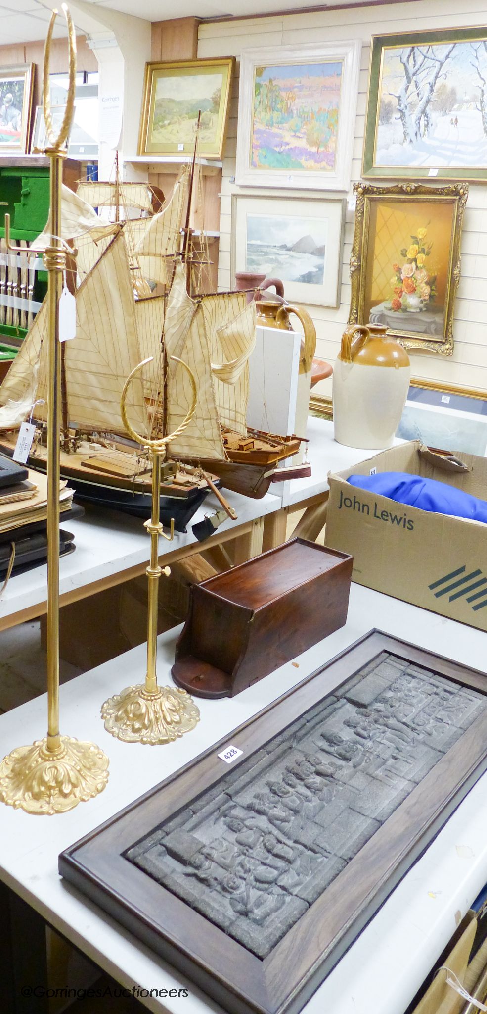 A pair of gilt hat and scarf stands, a temple plaque and a salt box